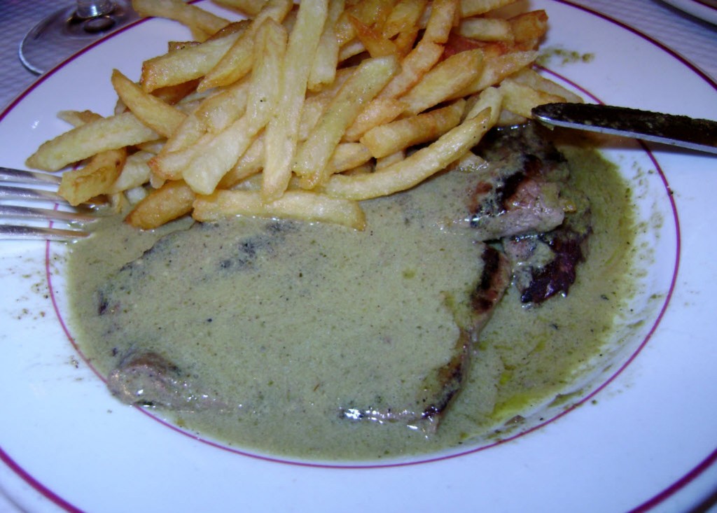 Steak smeared in gravy accompanied by fries Steak & Fries from Le Relais de l'Entrecôte