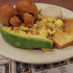 Breakfast (Jamaica) of ackee, salt fish, dumplings, Johnny Cakes, roasted breadfruit and avocado